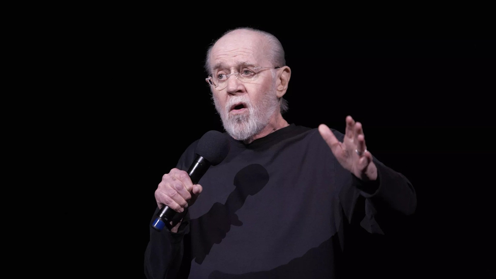 Unmasked with George Carlin Background