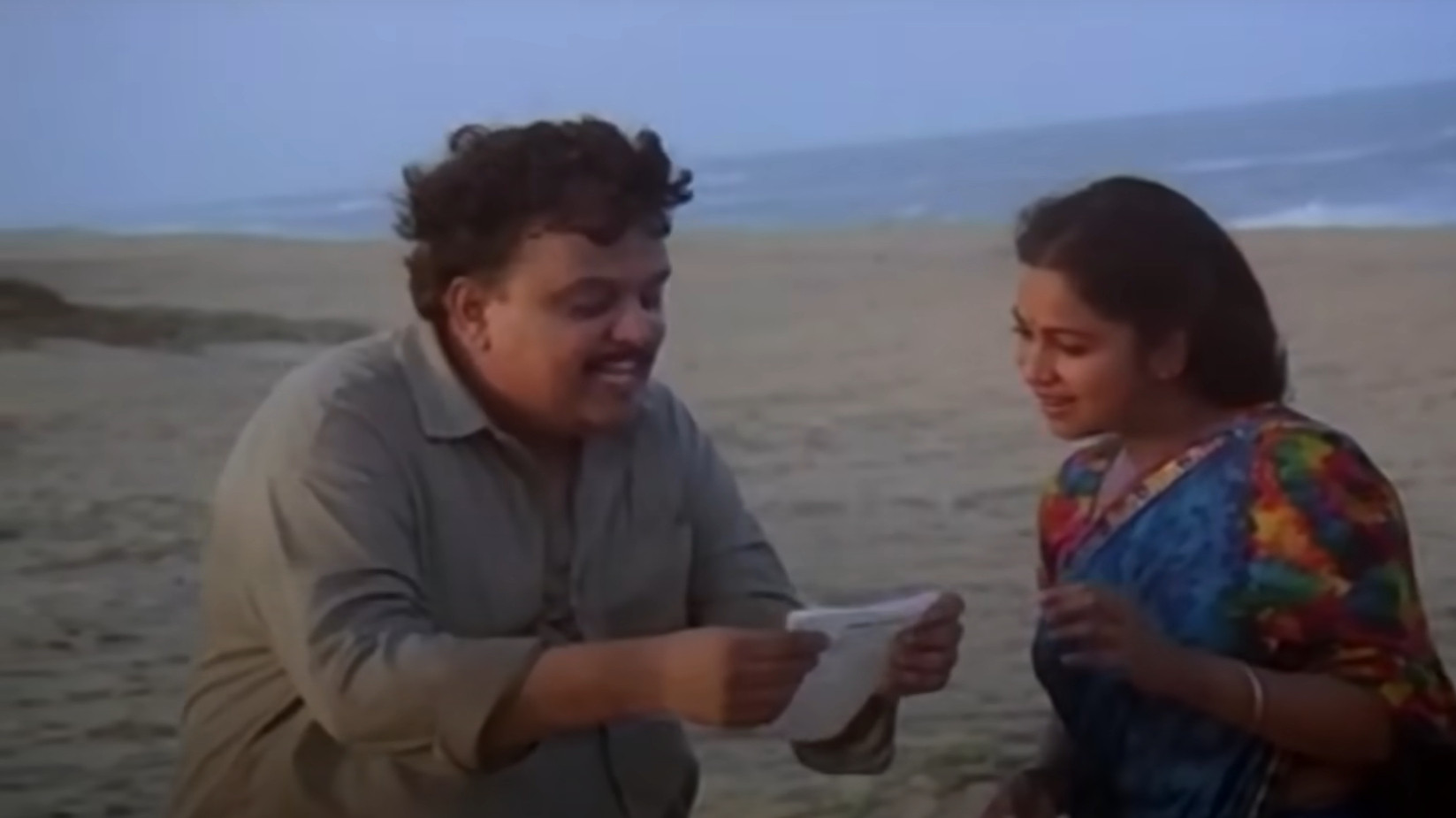 Keladi Kanmani Background