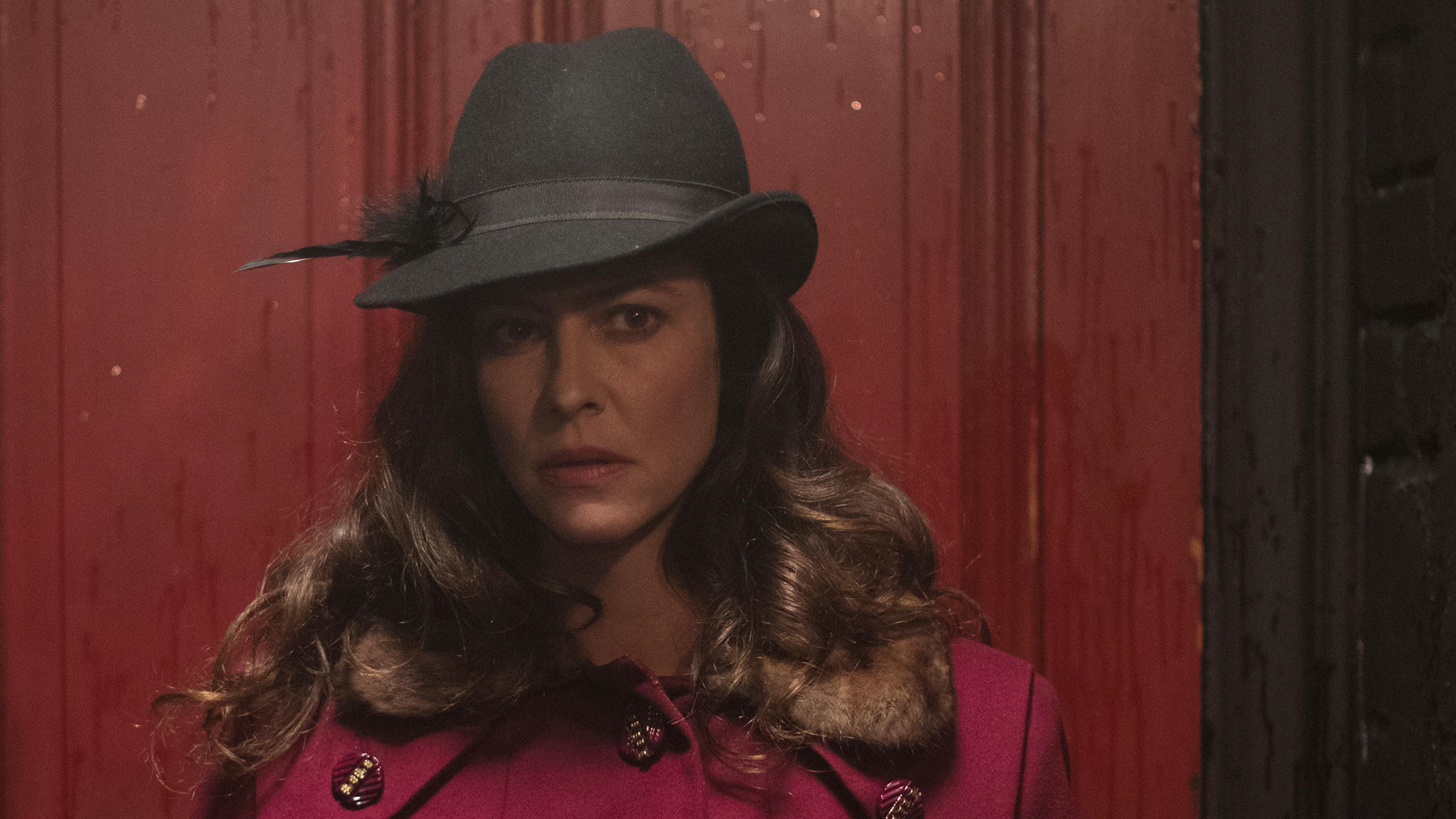 The Most Assassinated Woman in the World Background